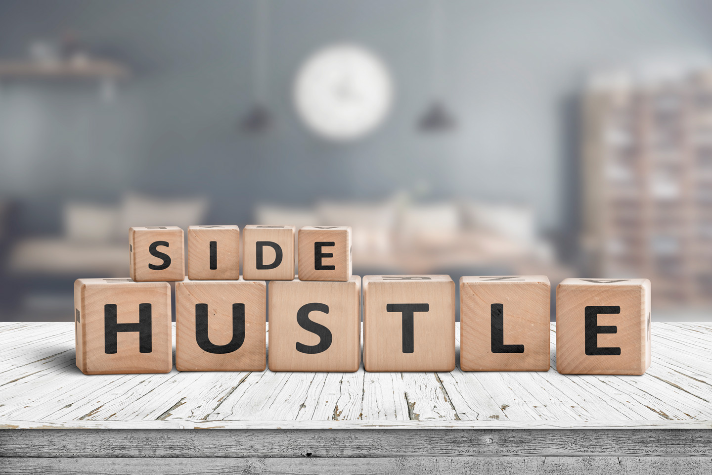 "Side Hustle" spelled in wooden blocks.