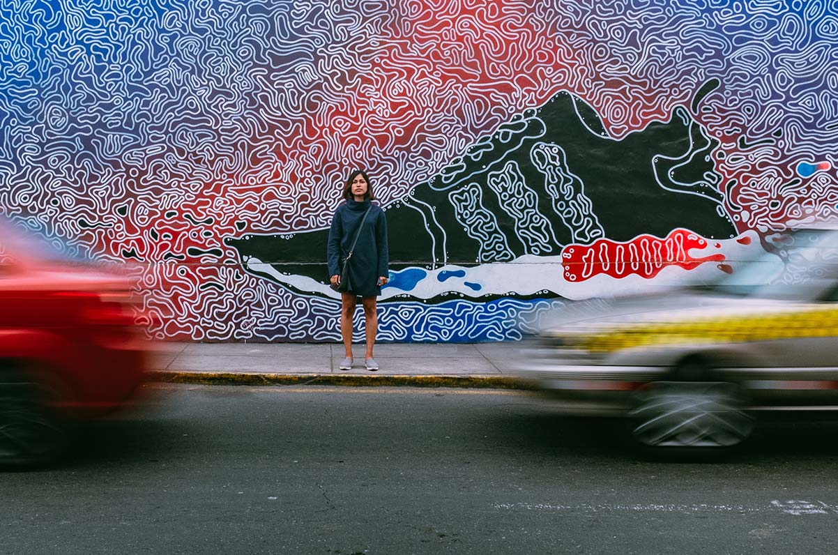 girl standing next to street